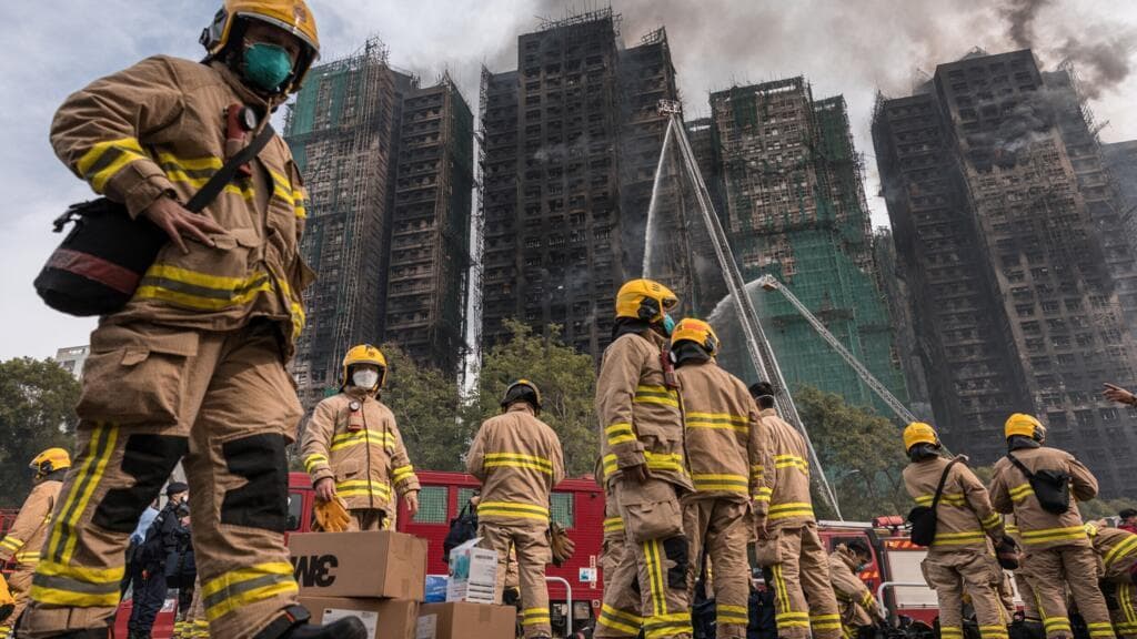 Hong Kong leader apologises and housing minister resigns after fire investigation exposes failures